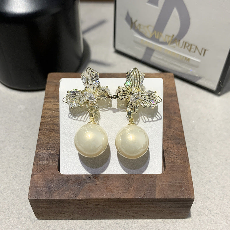 Gentle And Versatile Pearl Earrings With Diamond-Encrusted Butterfly Pendants